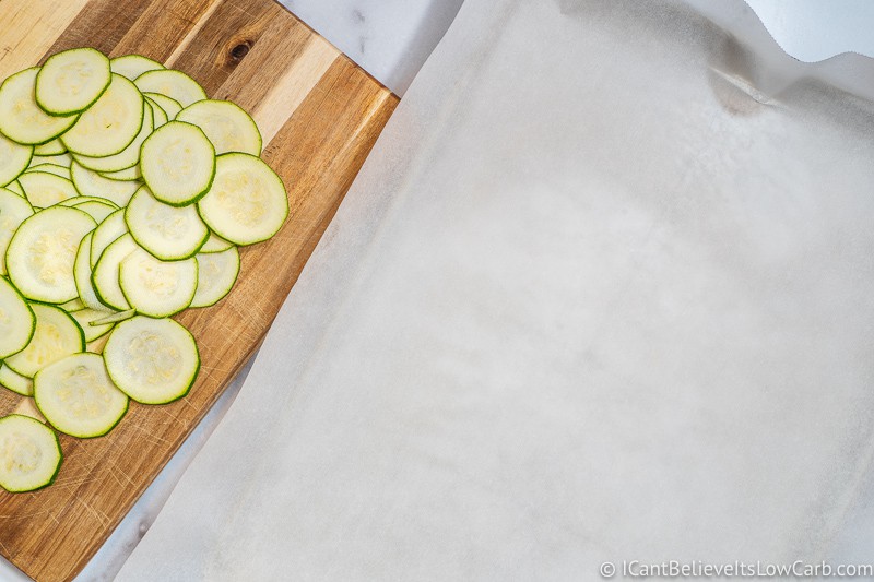 Getting ready to transfer sliced Zucchini onto sheet pan