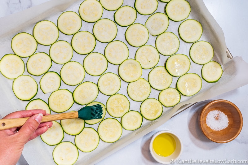 Brushing Zucchini with olive oil
