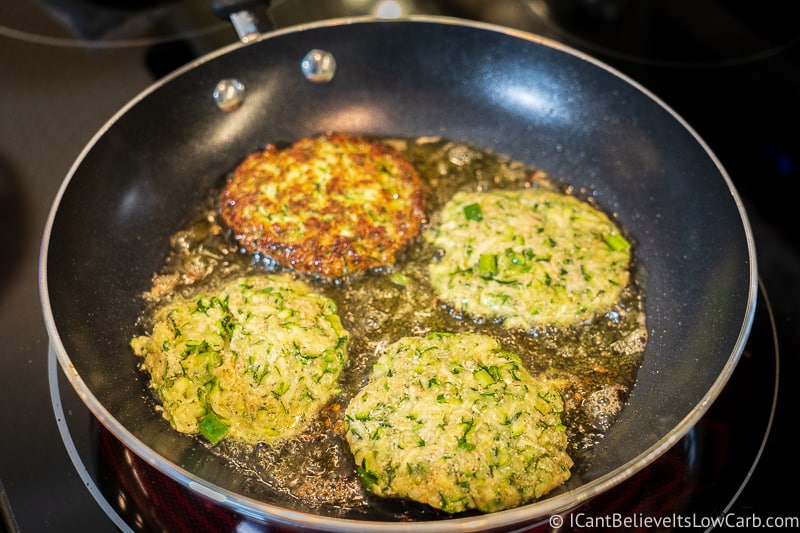 4 low carb Zucchini Fritters in frying pan