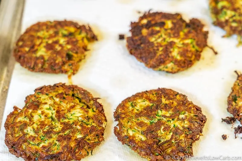 Zucchini Fritters absorbing oil on paper towels