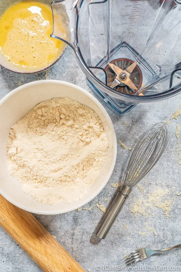 Coconut Flour Pie Crust ingredients on a bowl and a blender