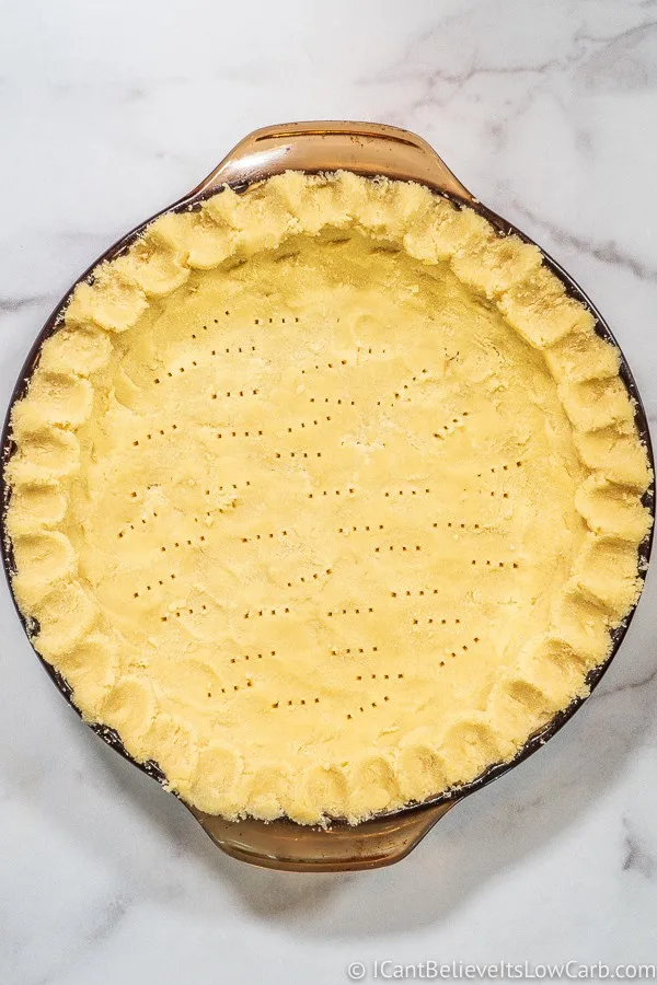 Uncooked Coconut Flour Pie Crust pressed into pie dish