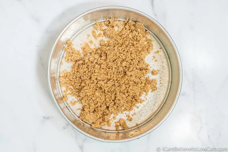 Adding Almond Flour Cheesecake crust to pan