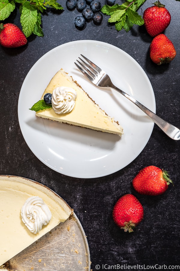a slice of sugar-free cheesecake on a plate with a fork