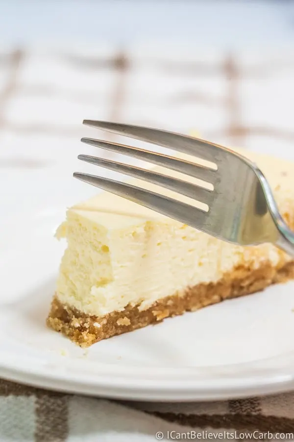 cutting Keto Cheesecake with a fork