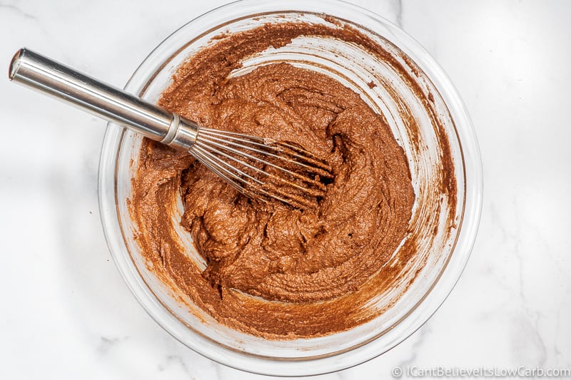 Mixing ingredients in a bowl Keto Chocolate Muffins
