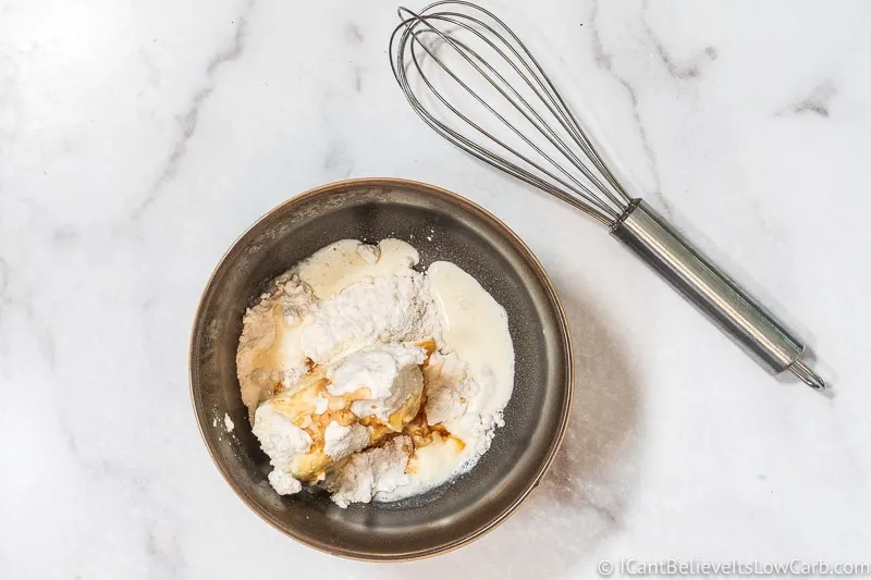 adding vanilla to frosting mixture