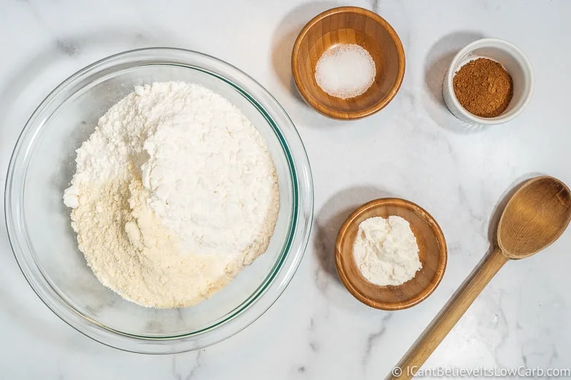 adding coconut flour to Keto Pumpkin Muffins