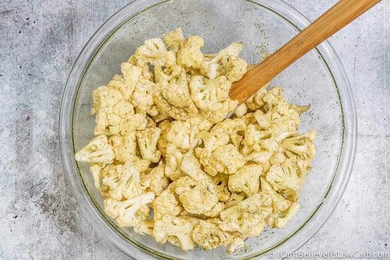 Mixing in Cauliflower with seasonings