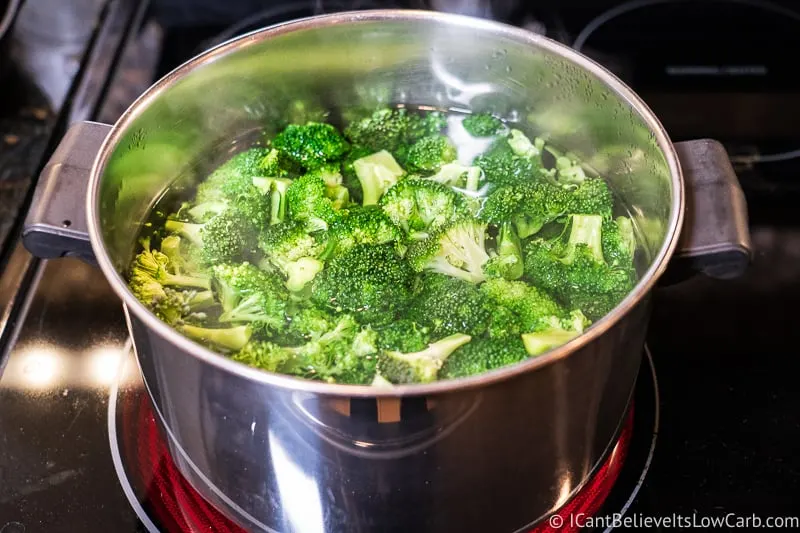 Broccoli boiling on the stove in pot of water