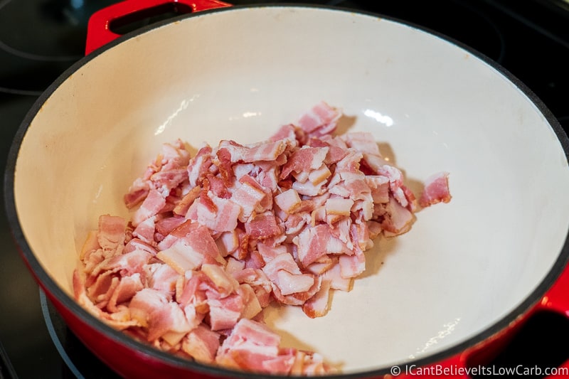 Putting bacon in frying pan