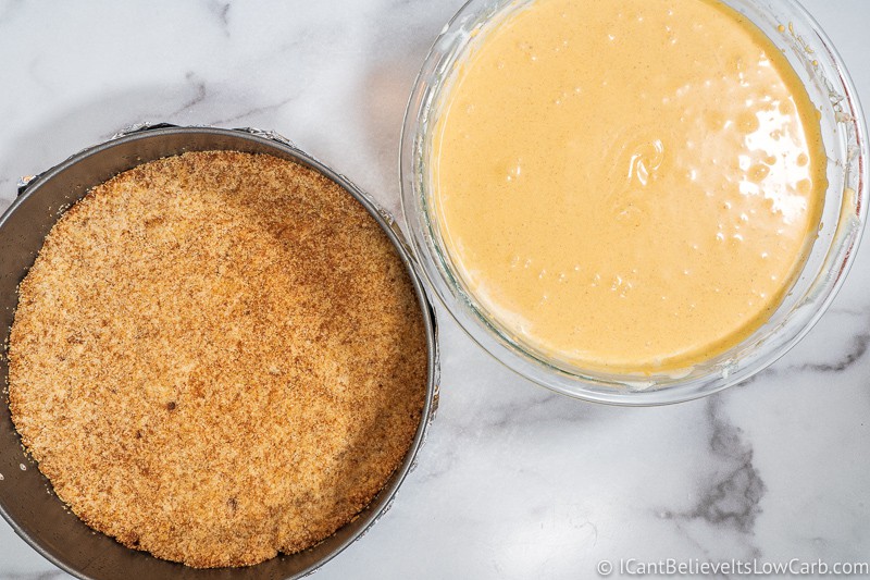 bowl of low carb pumpkin cheesecake filling in a bowl and crust