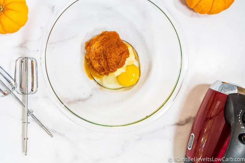 adding vanilla to bowl for Pumpkin Cookies