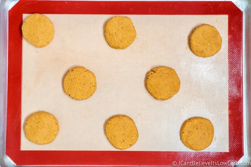 uncooked Keto Pumpkin Cookies on a baking tray after flattening