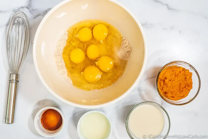 adding eggs to dry ingredients
