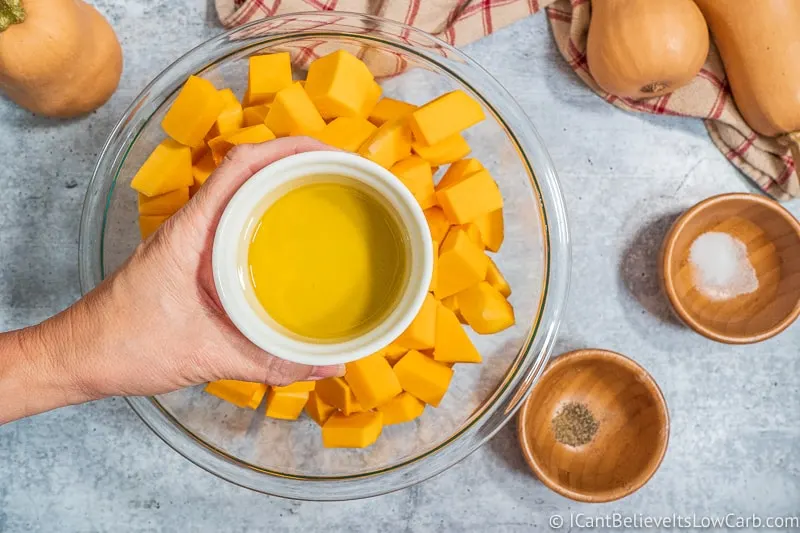 Putting oil on Butternut Squash cubes