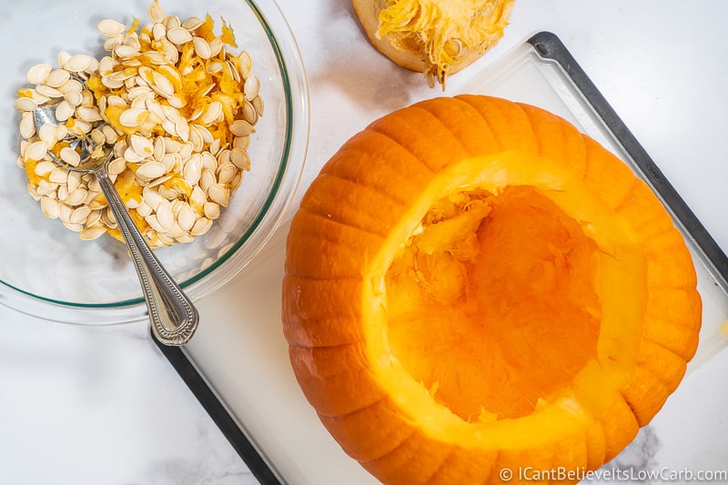 An empty Pumpkin with Seeds in a bowl