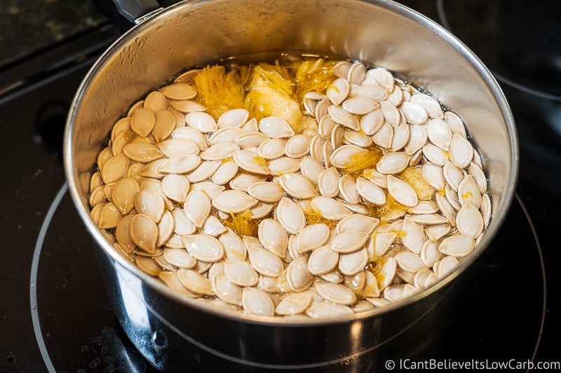Boiling Pumpkin Seeds on the stove to clean them