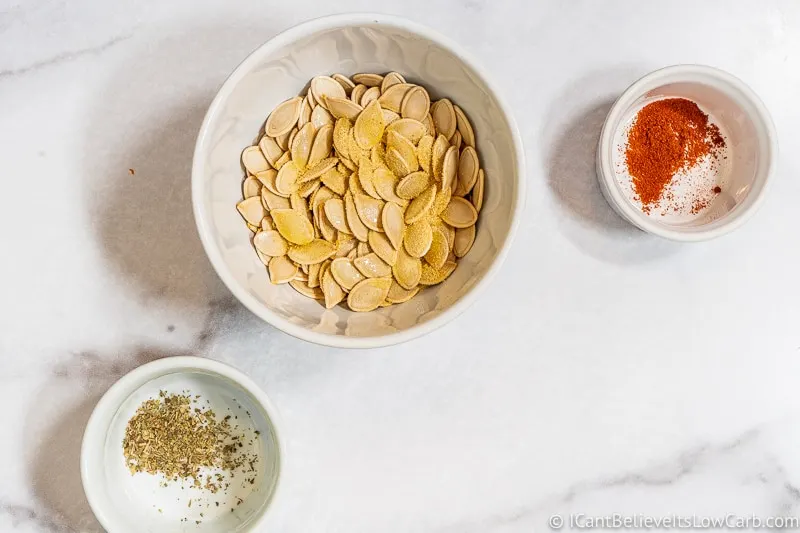 adding garlic powder to Pumpkin Seeds