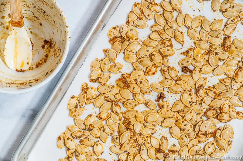 putting Italian Pumpkin Seeds on baking tray