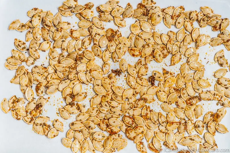 Pumpkin Seeds on baking sheet seasoned before baking