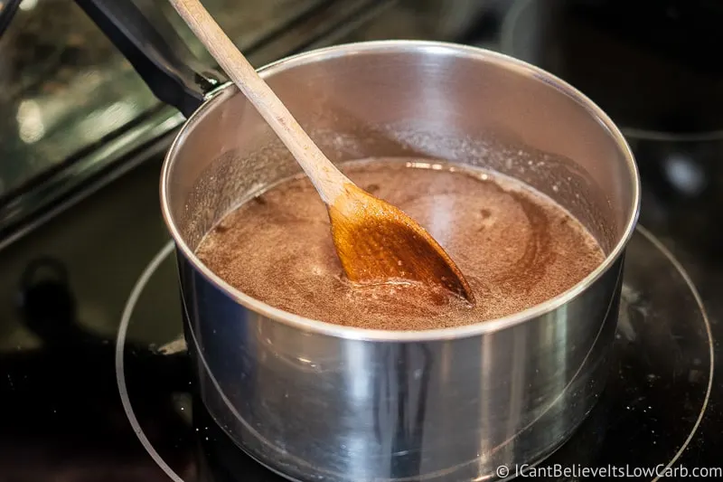 stirring Keto Maple Syrup in pan