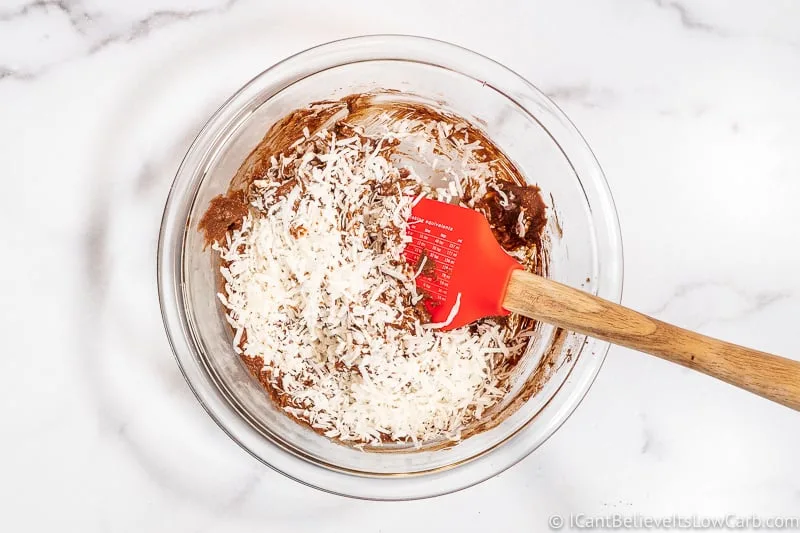 Mixing in shredded coconut to Keto no bake cookies