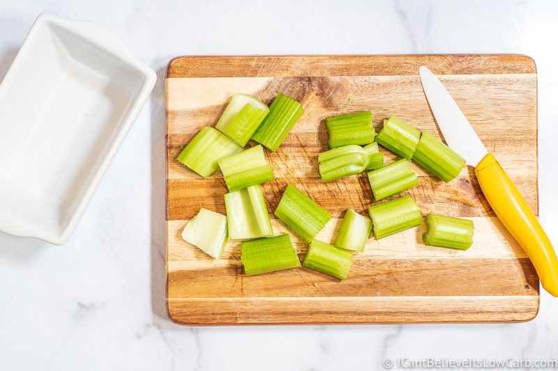 cutting celery on cutting board