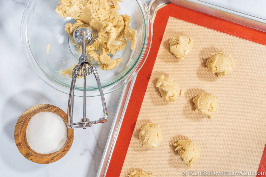Scooping out Keto Sugar Cookie dough in balls