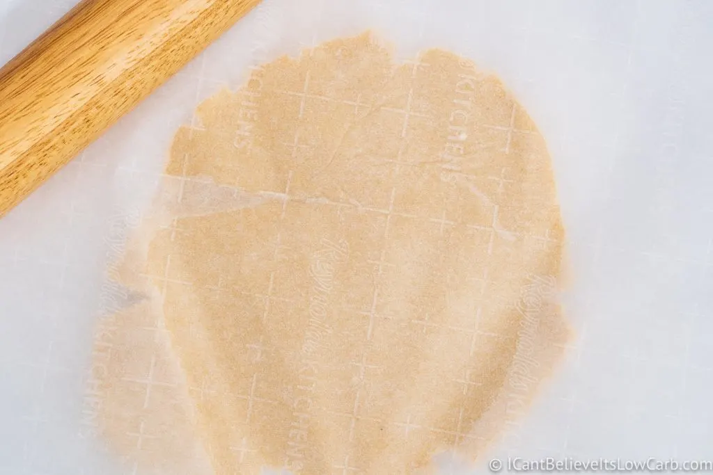 Flattening Sugar Cookie dough with parchment paper