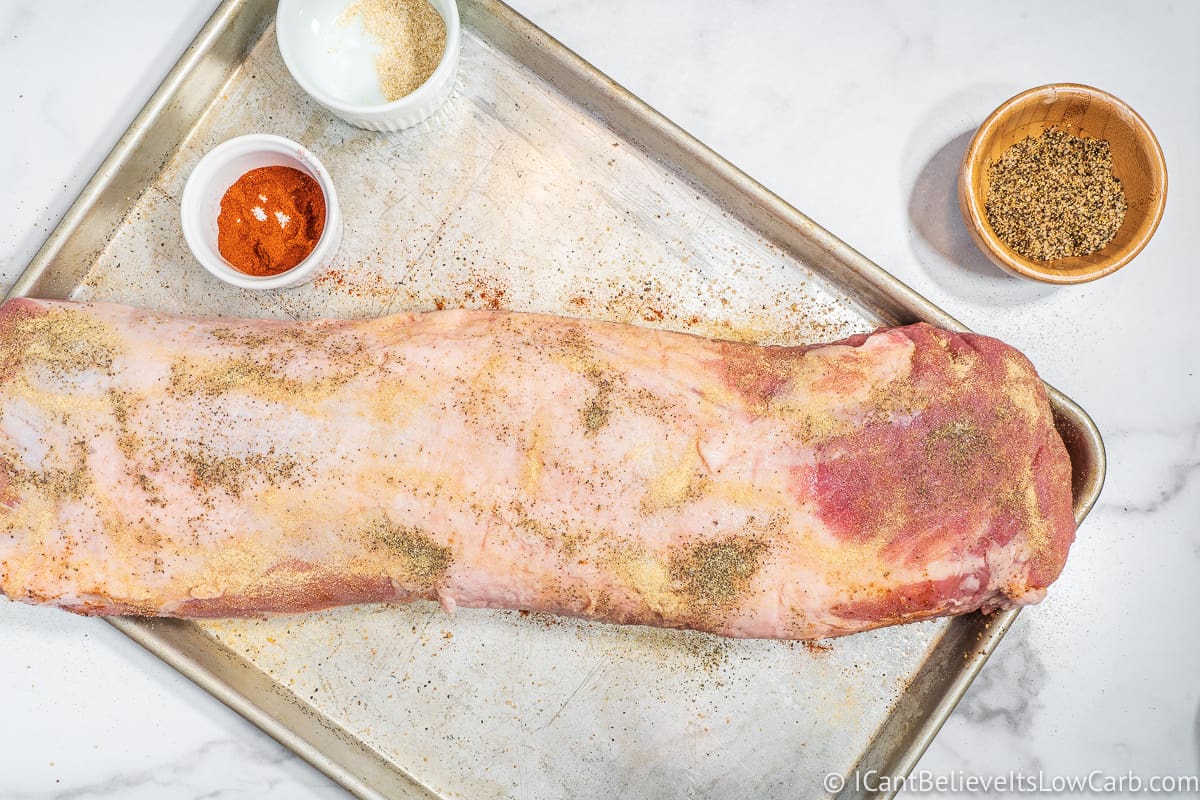 rubbing pork loin with garlic powder