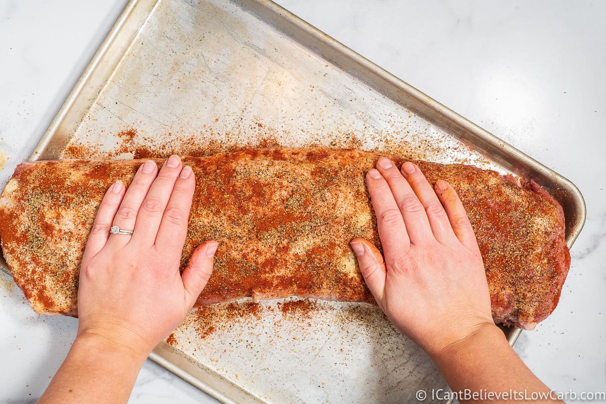 Rubbing in the seasonings on a Pork Loin