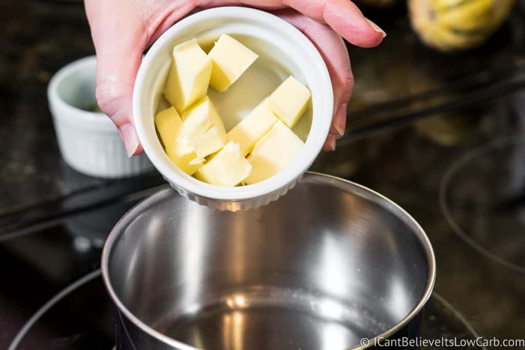 adding butter to a pan