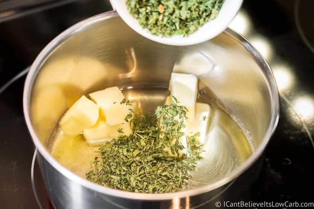 Adding parsley to the pan