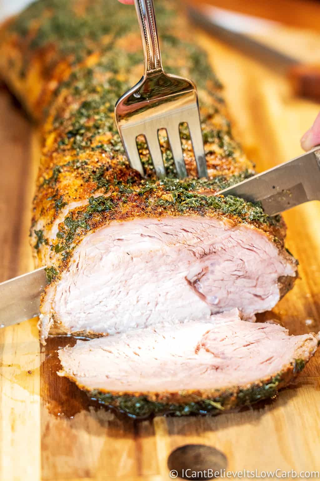 Cutting Pork Loin Roast with a knife