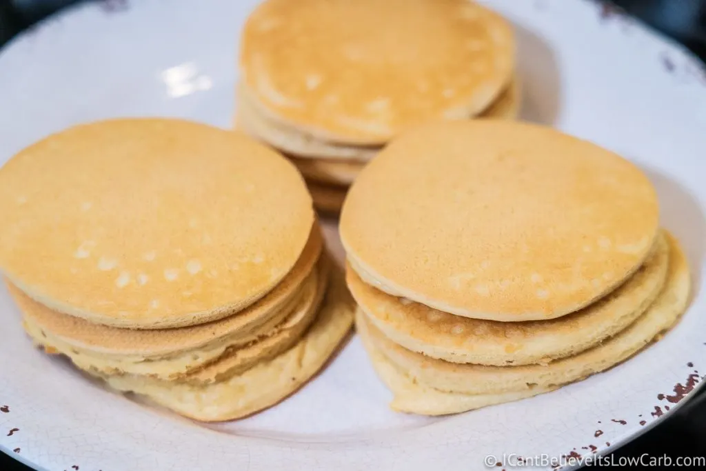three stacks of Almond Flour Pancakes on a white plate