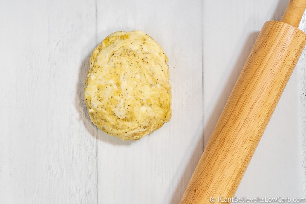 Fathead Pizza dough on the table with a rolling pin