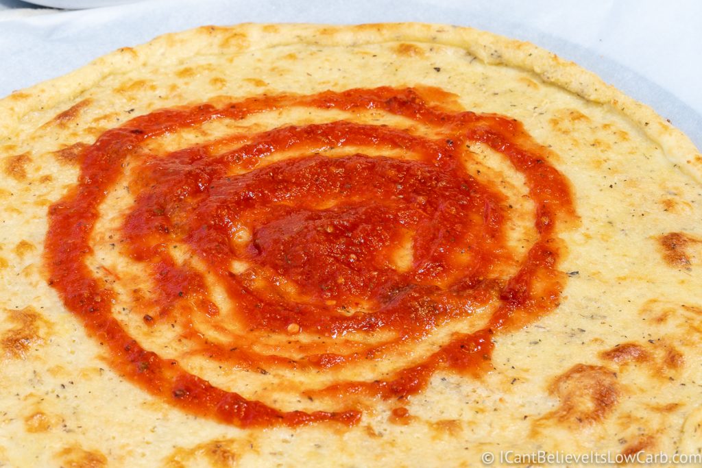Fat Head Pizza Crust with tomato sauce