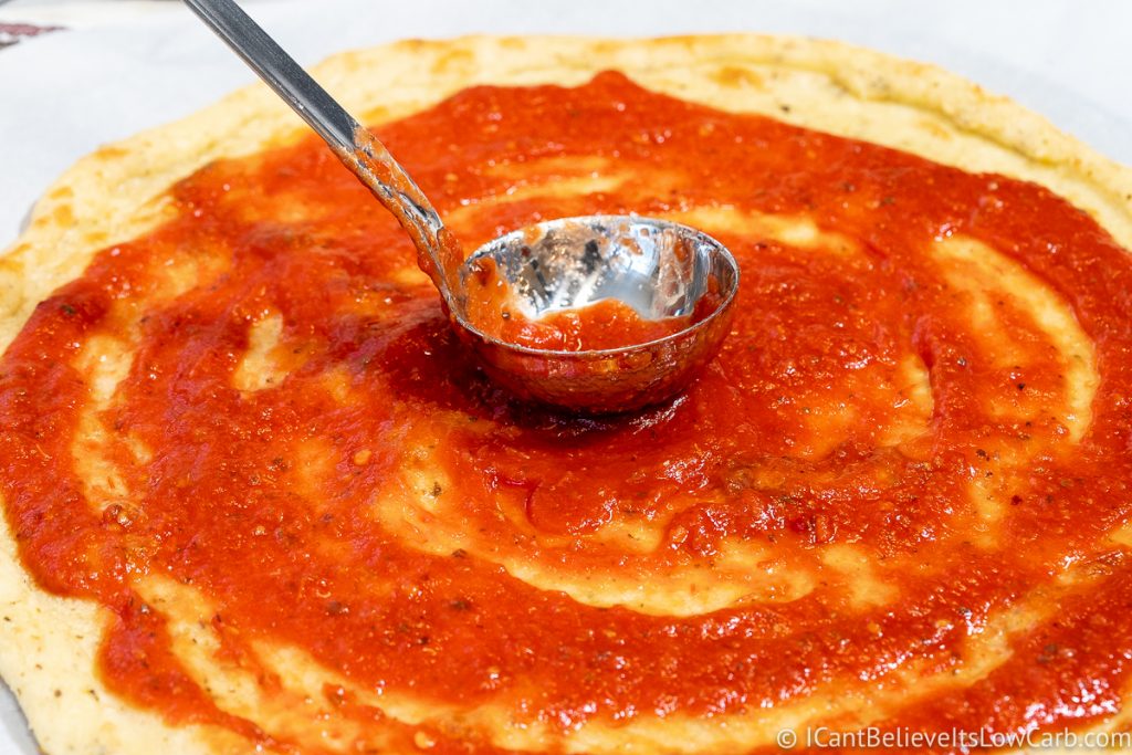 Fathead Crust covered in tomato sauce