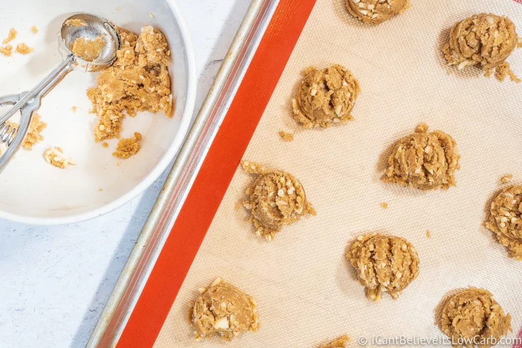 Scooping out Keto Oatmeal Cookie dough onto tray