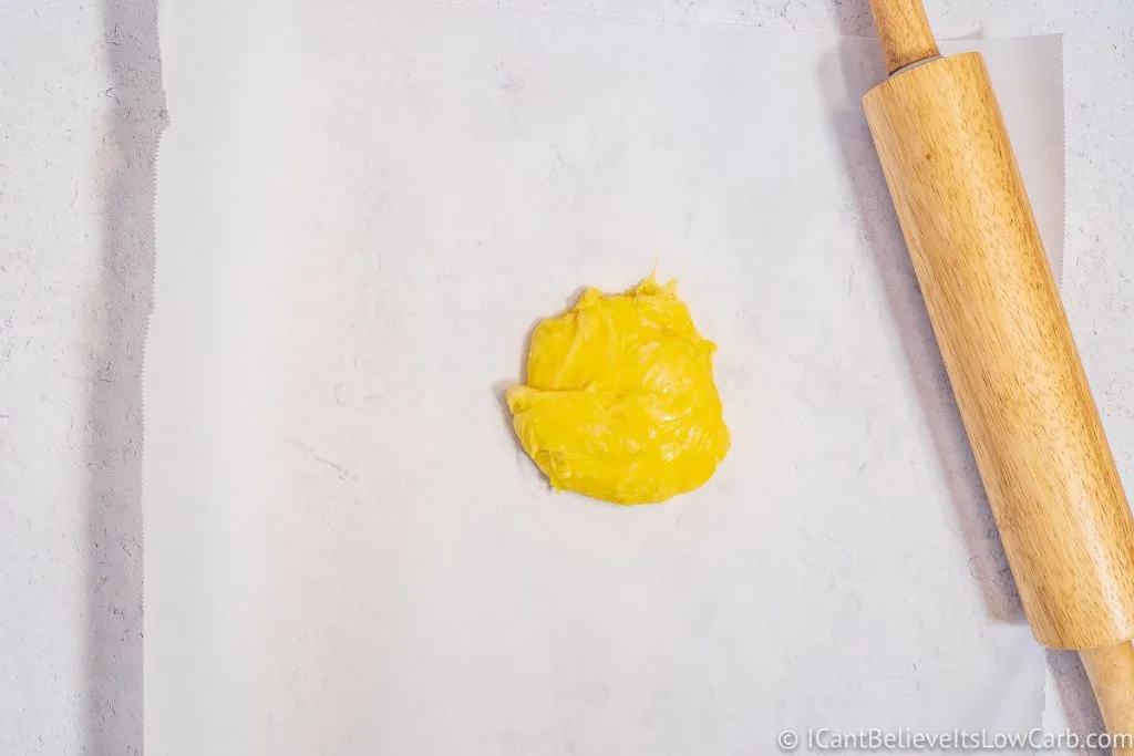 Keto Pasta dough on the table with a rolling pin