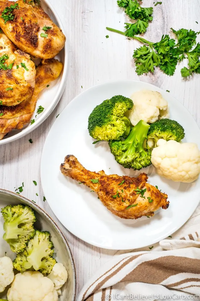 Baked Chicken Leg on a plate with broccoli