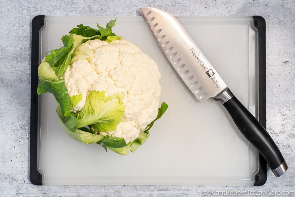 Cutting Cauliflower on cutting board