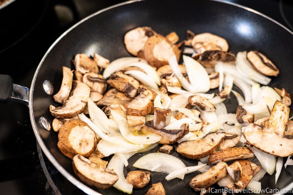 frying mushrooms and onions on the stove