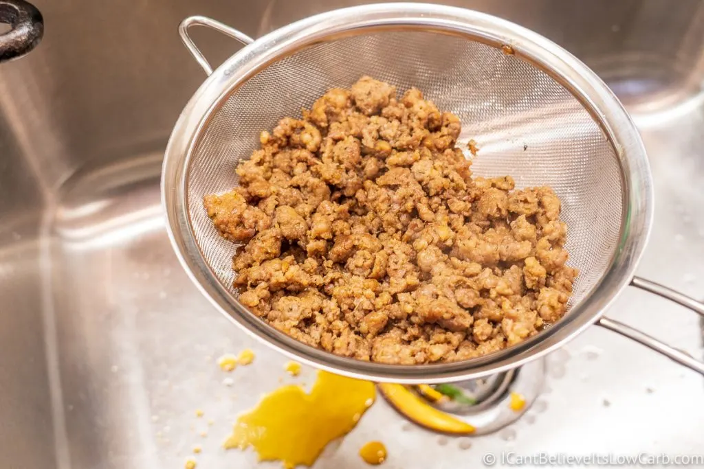 draining sausage grease in sink