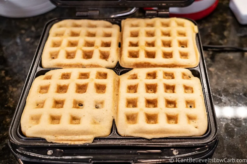 Keto Almond Flour Waffles cooking in waffle iron