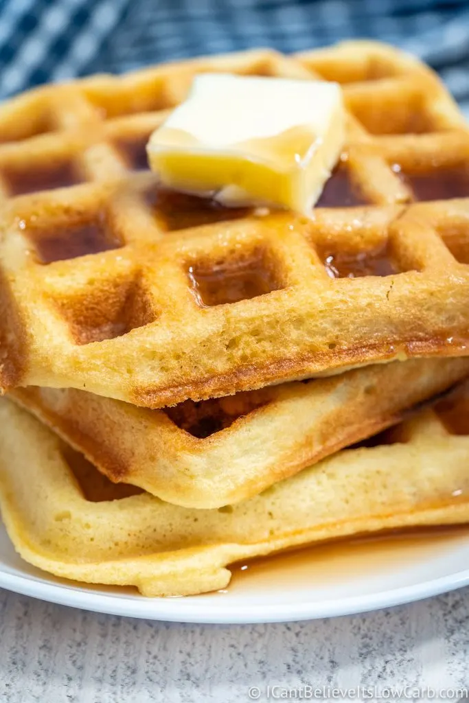 Low Carb Waffles covered in maple syrup and butter