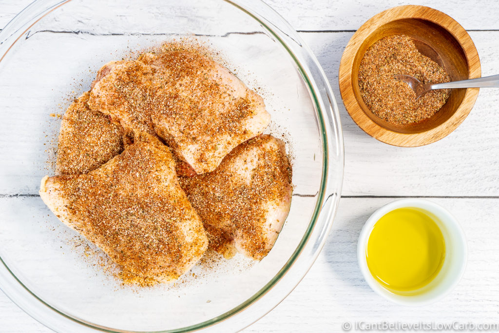 Covering Chicken Thighs with seasonings