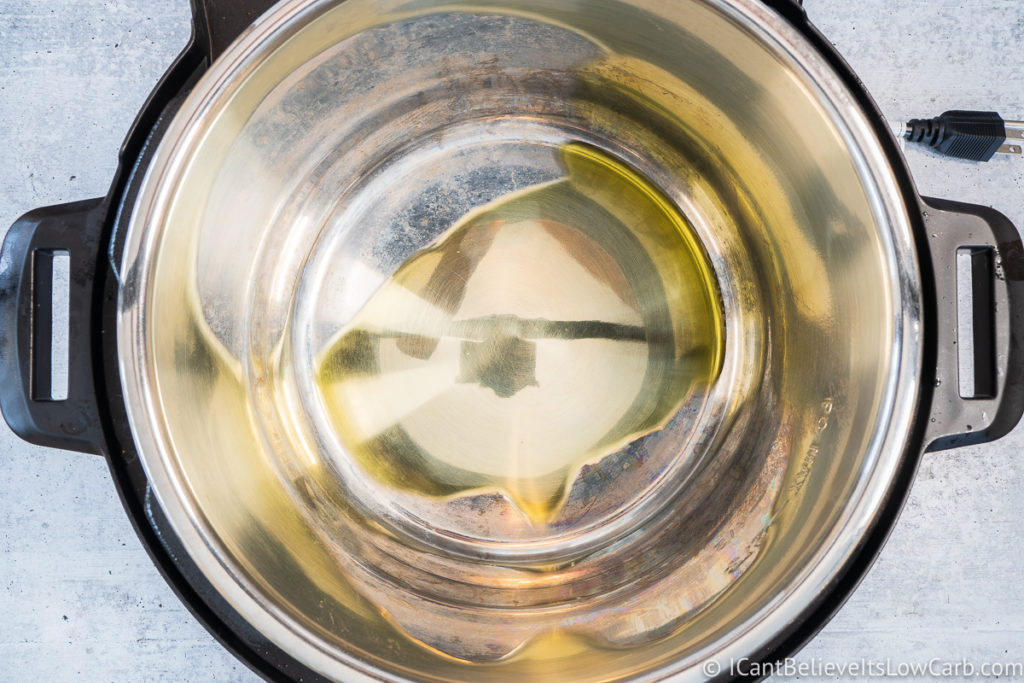 putting olive oil in an Instant Pot