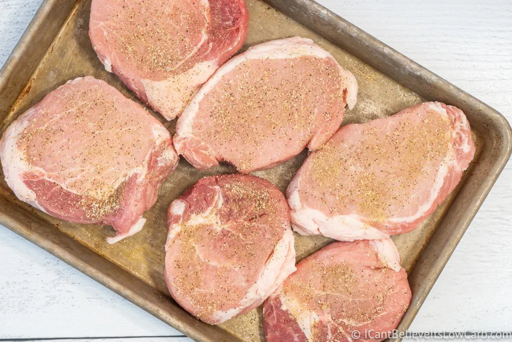 Boneless Pork Chops seasoned on a tray